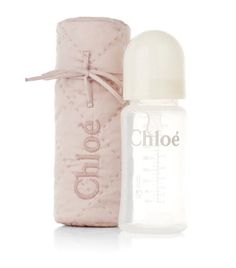 a baby bottle next to a pink tube with the word choice written on it and a white background