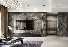 a modern living room with marble walls and flooring