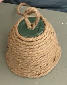 a rope wrapped bag sitting on top of a table