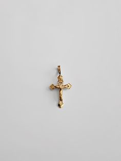 "Proclaim your love and believe in Christianity in the most sophisticated way. Highlight the power of your faith in Jesus Christ and His sacrifice through this 14K solid gold cross pendant. The minimalist cross pendant exquisitely represents the long-standing Christian faith through its elegant finish. Finely cut edges showcase utmost precision, giving the cross pendant a neat appeal that is captivating to the eyes. 100% tarnish-free, this solid gold pendant will shine as radiant as your faith i Spiritual 14k Gold Cross Necklace, 14k Gold Cross Pendant Spiritual Jewelry, Spiritual 14k Gold Cross Pendant, Yellow Gold Crucifix Necklace Tarnish Resistant, Spiritual Cross Pendant In Tarnish-resistant Material, Spiritual Cross Pendant Jewelry, Tarnish Resistant, Tarnish Resistant Yellow Gold Crucifix Necklace, Yellow Gold Tarnish-resistant Crucifix Necklace, Spiritual Tarnish Resistant Cross Pendant Jewelry