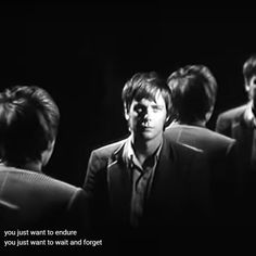 black and white photograph of men in suits with text that reads, you just want to endure if you just want to wait and forget