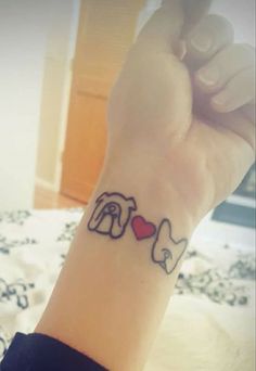 a person with a small tattoo on their wrist that says i love elephants and heart