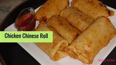 chicken chinese roll on a plate with dipping sauce