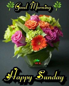 a vase filled with lots of flowers on top of a black table next to the words good morning happy sunday