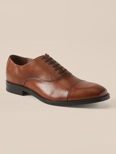 A clean and classic dress shoe with subtle cap-toe design, made in luxurious Italian leather.  Style with no-show socks and a smirk for an irreverent twist that's all confidence.  Flexible, leather or suede upper.  Designed with lightweight, durable Leather Cap, Dress Shoe, Leather Style, No Show Socks, Classic Dress, Toe Designs, Italian Leather, Cognac, Derby