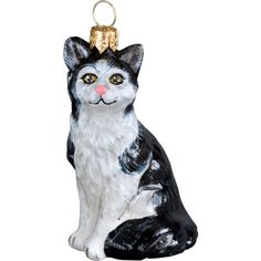 a black and white cat ornament with a bell on it's head