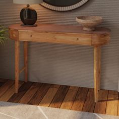 a wooden table sitting in front of a wall with a mirror on top of it