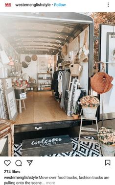 the inside of a moving truck with lots of furniture and decorations on display in it