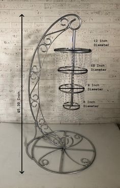 a metal stand with three tiers and measurements for the top section, bottom portion and bottom part