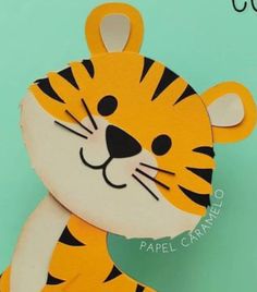 a close up of a paper cut out of a tiger with its head turned to the side