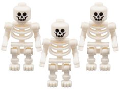 three white plastic skeleton figurines sitting next to each other on a white background