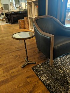 a chair and table in a room with wooden floors