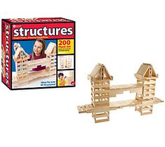 the wooden model is next to its box and instructions for making it look like they're