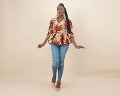 This stunning Enore African Print Wrap Top is the perfect blend of traditional African design and contemporary fashion. Made from vibrant Ankara fabric, this top features a flattering wrap silhouette that cinches at the waist, creating an elegant peplum effect. The puffy three-quarter sleeves add a stylish touch, making it ideal for both casual outings and more formal events. Whether paired with jeans for a casual look or with a skirt for a dressier occasion, this top is sure to turn heads and b Ankara Wrap Top, Ankara Blouse, African Design, Wrap Top, African Clothing, Contemporary Fashion, Clothing For Women, African Print, Piece Of Clothing