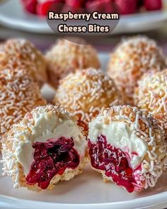 raspberry cream cheese bites on a white plate