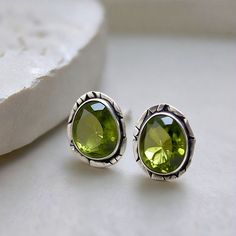 Discover the perfect accessory with these Tiny Silver Stud Cute Peridot Green Crystal Indian Earrings. Featuring a beautiful green peridot crystal, these Silver Stud Earrings are a stunning blend of traditional Indian design and modern charm. The Tiny Stud Earrings offer a subtle elegance, while the vibrant peridot adds a pop of color. These Cute Earrings are perfect for everyday wear or special occasions. Whether you're searching for Peridot Earrings, Green Earrings, or delicate Crystal Earrings, these handcrafted Indian Earrings will add a unique touch to your jewelry collection. What is Peridot? Peridot, also known as Chrysolite, is a variety of the Olivine mineral used as a gem.  Peridot is a 16th Anniversary gemstone.   Peridot Associations Chakras - Solar Plexus Chakra, Heart Chakra Peridot Crystal, Peridot Earrings, Peridot Green, Subtle Elegance, Tiny Studs, Indian Earrings, Tiny Stud Earrings, Earrings Green, Green Peridot