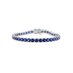 This 14.49 carat (ctw) lab-Created Blue Sapphire Classic Tennis Bracelet in Sterling Silver is the perfect combination of elegance and sophistication. The tennis bracelet design features 37 triangle-cut lab-created blue sapphires in a classic prong setting, totaling 14-1/2 carats. The sterling silver bracelet is polished to a high shine, giving it a luxurious look and feel. 14.49 Carat (ctw) Lab-Created Blue Sapphire Bracelet in Sterling Silver (7.25 Inches) Size: one size.  Gender: female.  Age Blue Tennis Bracelet With Prong Setting For Formal Occasions, Elegant Blue Bracelet With Brilliant Cut, Blue Brilliant Cut Tennis Bracelet For Gift, Luxury Blue Gemstone Tennis Bracelet, Blue Brilliant Cut Tennis Bracelet Gift, Luxury Blue Diamond Bracelet For Anniversary, Luxury Blue Diamond Anniversary Bracelet, Classic Blue Diamond Bracelet For Formal Occasions, Blue Oval Tennis Bracelet For Formal Occasions