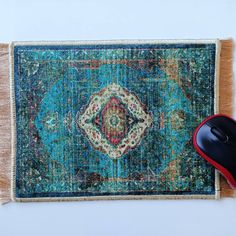 a computer mouse sitting on top of a rug