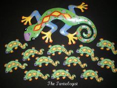 an assortment of green and yellow geckos on black background with smaller ones in the foreground