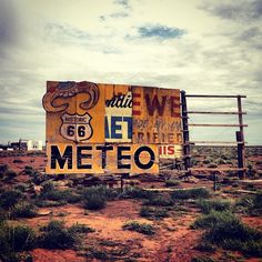 a sign in the middle of nowhere that says we are meteo on it's side