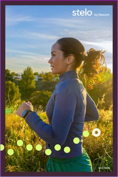 a woman is running through the grass with her hair in a ponytail and green pants