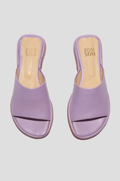 Get ready for the Pileta Slide in Lilac to be your favorite summer shoe. It's got the ease of a flip-flop but is as finely crafted as any shoe in our collection, which means it's going to be a keeper. Its simple shape and stand-out color will make it easy to combine with a range of textures, fabrications and silhouettes in your summer wardrobe. Who it's for: The woman who loves a pop of color. Kidskin upper with vegetable tanned leather lining and a 25 mm stacked leather heel and sole. Handmade in Argentina. Summer Shoe, Loafer Mules, Slide In, Flat Boots, Heeled Loafers, Simple Shapes, Vegetable Tanned Leather, Boot Sandals, Flip Flop