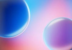 two blue and pink circles are shown in this abstract image, with the background blurry