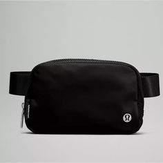 Brand New, Still In Plastic Blk Lululemon Everywhere Belt Bag. Great For On The Go Travel. Can Be Use Across The Waist Or As A Crossbody Bag. Exterior Zippered Pocket To Secure Your Valuables. Interior Pockets Hold The Essentials. Bag Dimensions: 19cm X 5.5cm X 13cm (7.5" X 2" X 5") Volume: 1l Strap Length When Fully Extended: 16cm (41.7”) Questions? Leave A Comment Below! Lululemon Bags, Lululemon Everywhere Belt Bag, Everywhere Belt Bag, Pocket Storage, Festival Bag, Black Crossbody, Metallic Logo, Black Belt, Large Bags