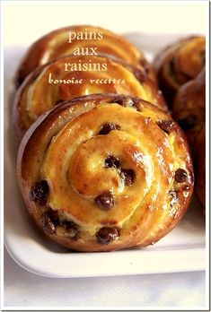 some very tasty looking pastries on a white plate with the words paris aux raisins