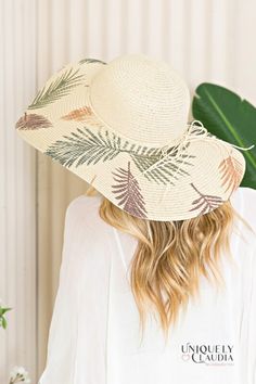 Take your vacay or weekend getaway up a notch with our Palm Beach Floppy Sun Hat! Look effortlessly sophisticated with this stunning sun hat that is composed of woven straw that shapes a high crown, a rounded top, and a wide, floppy brim (that can be shaped any way you wanna wear it!) with a knotted bow accent at the band. 6" brim. 22.5" interior circumference with an adjustable internal drawstring. Crown measures 4" tall 100% Paper Spot Clean Hand Made / Hand Printed Imported Sun Straw Hat With Uv Protection For Vacation, Uv Protection Sun Straw Hat For Vacation, Beachy Straw Boater Hat For Vacation, Adjustable Tropical Summer Hat, Summer Sun Straw Hat Made From Palm Leaf, Sun Panama Hat For Beach Vacation, Wide Brim Hats With Uv Protection For Vacation, Wide Brim Straw Boater Hat For Vacation, Vacation Hat With Uv Protection