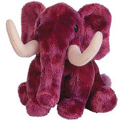 an elephant stuffed animal sitting up against a white background