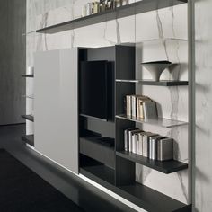 an entertainment center with bookshelves and shelves