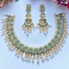 Traditional and timeless jadau necklace set made in sterling silver with 22K gold plating. It has been embellished with freshwater pearls and turquoises. The hanging beads are freshwater pearls. Turquoise Pearl Drop Jewelry, Turquoise Kundan Necklace With Meenakari Detailing, Jadau Necklace Set, 22k Gold Jewelry Necklaces, Jadau Necklace, 22k Gold Jewelry, Hanging Beads, Pearl Necklace Set