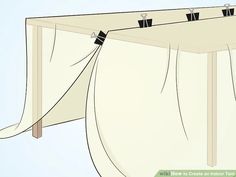 an open curtain with clothes hanging from it's sides and two clips attached to the side