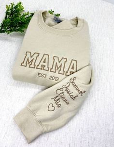 "Personalized Mama Sweatshirt with Kids Names, Custom Mama Sweatshirt Names on Sleeve, Crewneck Sweatshirt, Gift for Mama  Embroidered area is approximately 7x3 Inches  Gift for Mama, future Mama sweatshirt, new Mama sweatshirt, Mama to be gift. Mama Sweatshirt It is a great gift for mothers day, next mama to be ! It is a great gift for your wife. Check size chart before ordering.. Check out the \" RUSH MY ORDER \" listing I have so you can receive your order faster.  - No Refunds, exchanges, or Mama Sweatshirt Ideas, Mama Sweatshirt With Names On Sleeve, Personalized Mama Sweatshirt, Momma Sweatshirt Ideas, Mama Hoodie Ideas, Embroidered Mothers Day Gifts, Cricut Projects Sweatshirts, Cute Mama Shirts, Mothers Day Sweatshirt