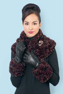 a woman wearing black gloves and a scarf