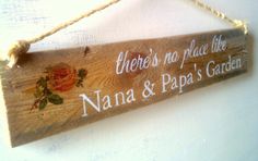 there is no place like nanna & papa's garden sign hanging on the wall