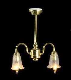 two light brass chandelier with white glass shades