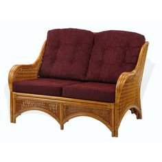 a wooden couch with red cushions on it