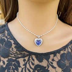 This gorgeous Sterling Silver cubic zirconia studded Tanzanite heart necklace and earring set would make the perfect classy gift for a bridesmaid, as an anniversary gift, for Valentine's Day or for Mother's Day. Tanzanite is the birthstone for those born in December, making it a thoughtful birthday gift as well! Pictures were taken both indoor and outdoors to best represent color. ~Measurements~ The heart pendant measures 1" tall and 3/4" wide. The Tanzanite heart stone is 12mm x 12mm. The match Born In December, Well Pictures, Tanzanite Jewelry, Jewelry Heart, Heart Stone, Jewelry Bridal, Necklace And Earring Set, Hair Accessories Jewelry, December Birthstone