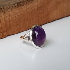 Amethyst ring, Sterling Silver ring, cocktail ring, alternative engagement ring, Amethyst jewelry, Valentine's day jewelry, silver jewellery Description: Be assured that the product you order is MADE JUST FOR YOU and is not a mass produced item. The gemstone is a oval shaped AMETHYST GEM SIZE- 12*16mm The rest of the ring is made from 925 STERLING SILVER i.e 92.5% pure silver. And it DOESN'T HAVE ANY LEAD OR NICKEL. FOR A COMPLETE LOOK DO CHECK THEM: https://www.etsy.com/listing/645670663/natura Amethyst Open Ring Fine Jewelry, Sterling Silver Gemstone Rings For Formal Occasions, Amethyst Solitaire Crystal Ring In Fine Jewelry Style, Silver Solitaire Ring Gemstone, Adjustable Gemstone Signet Ring, Fine Jewelry Amethyst Ring With Open Design, Formal Sterling Silver Gemstone Rings, Amethyst Gemstone Birthstone Open Ring, Amethyst Open Ring Birthstone