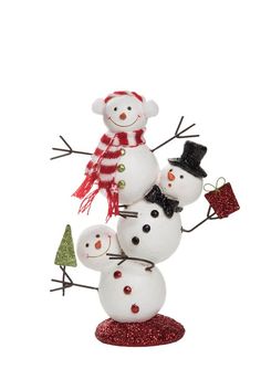 a group of snowmen with hats and scarves