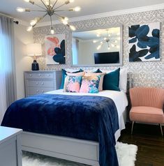 a bedroom with blue and pink decor on the walls