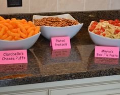 three bowls filled with different types of food on top of a counter next to each other