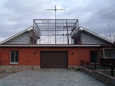 a red brick house with a glass roof