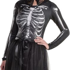 a woman is wearing a skeleton costume