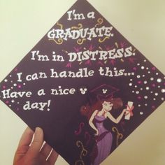 someone is holding up a graduation cap that says, i'm a graduate i'm in distresss i can handle this have a nice day