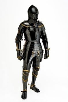 a man dressed in black and gold armor