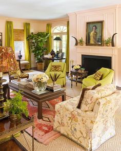 a living room filled with furniture and green curtains