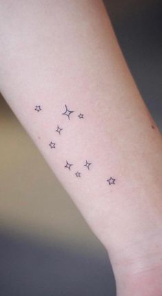 small stars tattoo on the wrist